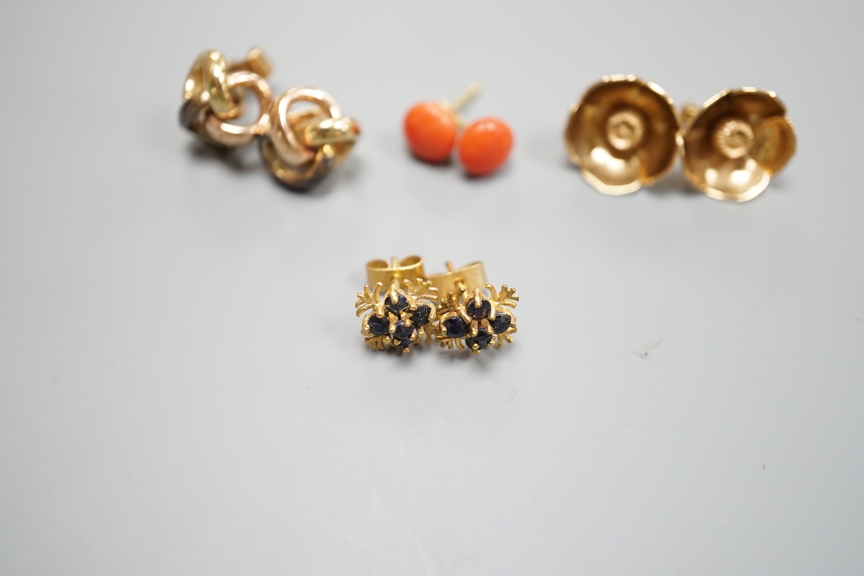 A pair of 750 yellow metal and coral bead ear studs, gross weight 1.8 grams and three pairs of modern 9ct earrings including knot and gem set, gross weight 12.2 grams.